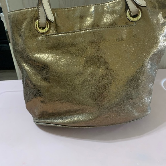 Michael Kors Authentic
Metallic Gold Purse - Picture 1 of 9